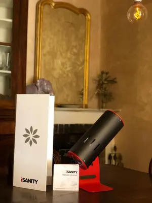 a black flashlight sitting on a table next to a box at Pantheon Old Suite in Rome