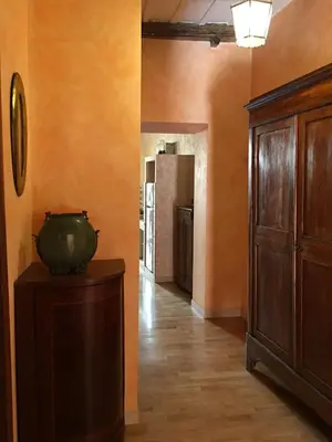 a hallway with a room with a kitchen and a cabinet at Pantheon Old Suite in Rome