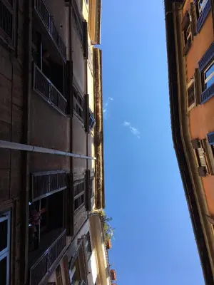a view of the sky from between two buildings at Pantheon Old Suite in Rome