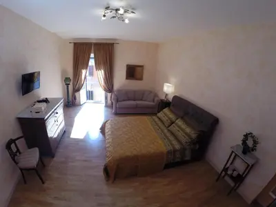 a bedroom with a bed and a couch at Pantheon Old Suite in Rome