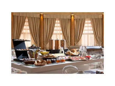 a buffet line with various pastries and other food items at TH Roma - Carpegna Palace in Rome