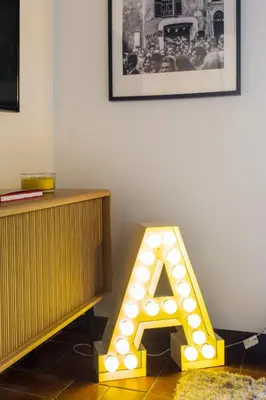 a light up letter a in a room at Andreasuite Trastevere in Rome