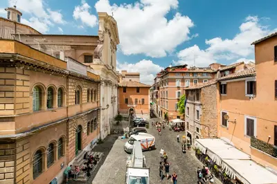 a view of a street in a city with buildings at Andreasuite Trastevere in Rome