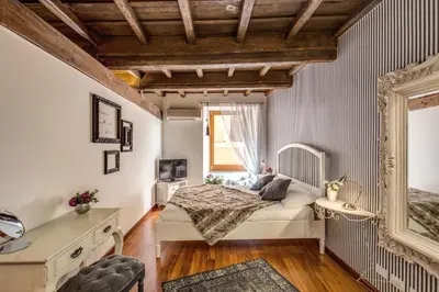 a bedroom with a bed and a window at Pantheon Miracle Suite in Rome