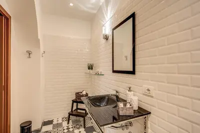 a bathroom with a sink and a mirror at Pantheon Miracle Suite in Rome