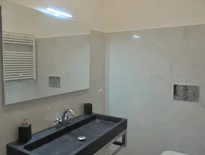 a bathroom with a black sink and a mirror at La Tana di Sofia in Rome