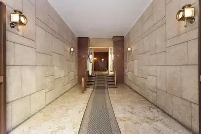 a hallway with a staircase in a building at The Apartment Trastevere - Ba.home in Rome