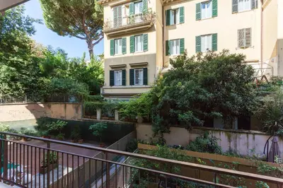 an apartment building with stairs leading up to it at The Apartment Trastevere - Ba.home in Rome
