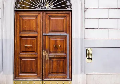 a wooden door on the side of a building at Eterna Roma in Rome