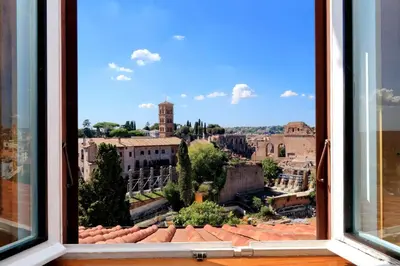 a view of a city from a window at Fori Imperiali Apartment in Rome