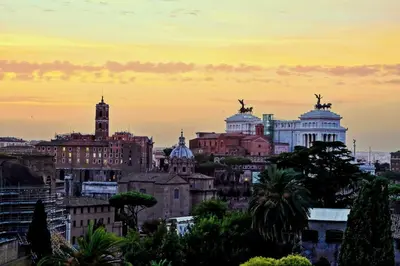 a view of a city at sunset at Fori Imperiali Apartment in Rome