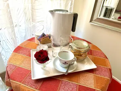 a table with a coffee maker and a coffee cup at Santa Maria Maggiore in Rome