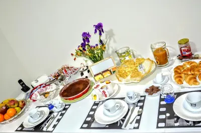 a table with a buffet of food and desserts at Santa Maria Maggiore in Rome