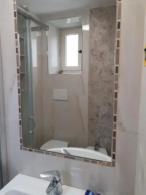 a bathroom with a sink and a mirror at Hotel Kennedy in Rome