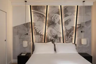 a bed with two white pillows in a bedroom at BDB Rooms Navona in Rome