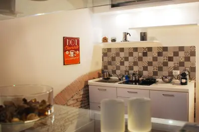 a kitchen with a sink and a counter top at SuityRHome RioneMonti118 in Rome