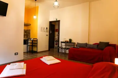 a living room with a couch and a red blanket at Nonna's house in Rome
