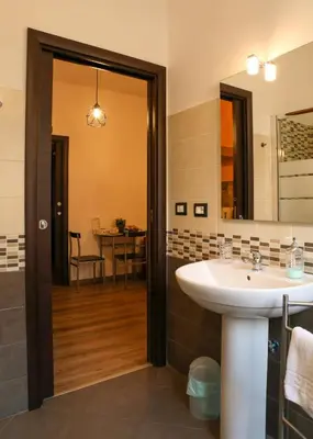 a bathroom with a sink and a mirror at Nonna's house in Rome