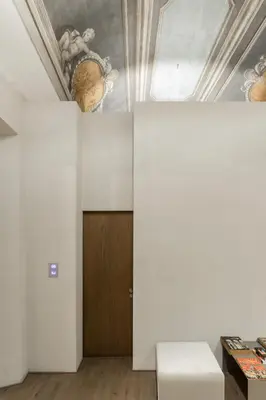 a room with a wooden door and a ceiling at Hotel dei Barbieri in Rome