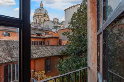 a view of the city from a window at Hotel dei Barbieri in Rome