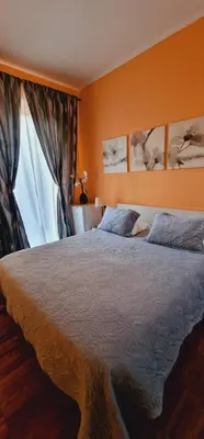 a bedroom with a large bed and a window at Fornaci Guest House in Rome