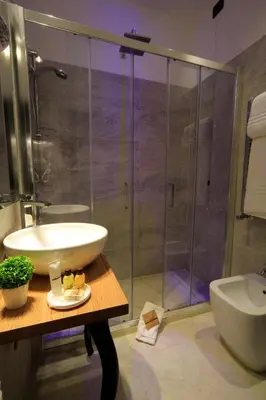 a bathroom with a sink and a shower at K Rooms in Rome