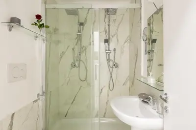 a bathroom with a shower and a sink at Little Aurelius in Rome