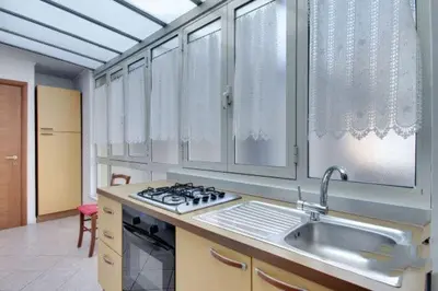 a kitchen with a sink and a stove at La Dolce Vita Colosseum in Rome