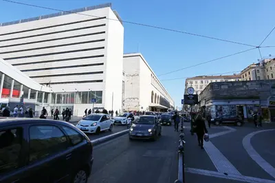a busy city street with cars and people and buildings at AdoraSuite 2 in Rome