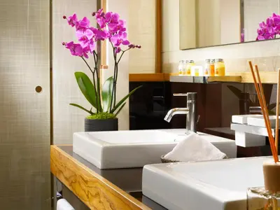 a bathroom with two sinks and a mirror at Mario De' Fiori 37 in Rome