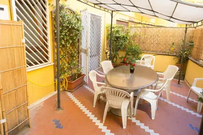a patio with a table and chairs on a patio at Da Paolo al Vaticano in Rome