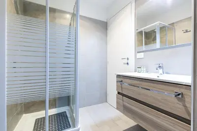 a bathroom with a shower and a sink at Sallustio Fine Rooms Guest House in Rome