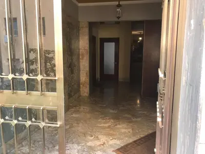 a hallway of a building with a glass door at Dunant House in Rome