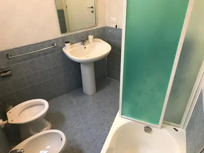 a bathroom with a toilet and a sink at Dunant House in Rome