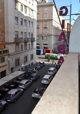 a group of cars parked in a parking lot at Bloom Apartment in Rome