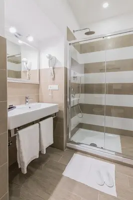 a bathroom with a sink and a shower at Bloom Apartment in Rome