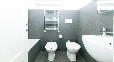 a bathroom with a toilet and a tub and a sink at Parioli House near Borghese-LUISS University in Rome