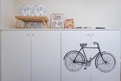 a bike is sitting on top of cabinets at Bed&BikeRome ROOMS in Rome