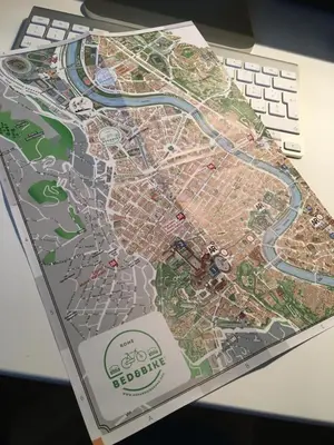 a map of a city on top of a desk at Bed&BikeRome ROOMS in Rome