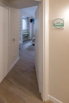 a hallway with a hallway flooring in a house at Bed&BikeRome ROOMS in Rome