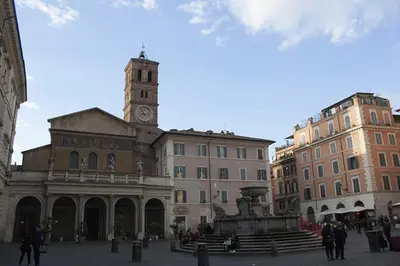 a building with a clock tower and a fountain at Splendid House In Trastevere in Rome