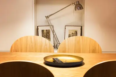 a wooden table with a plate on top of it at TrastevereHome - Vespucci Rome Testaccio Home in Rome