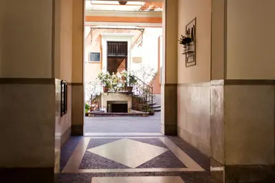 a hallway with a fireplace in a building at TrastevereHome - Vespucci Rome Testaccio Home in Rome