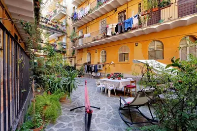a bike parked in a courtyard of a building at Pretty Flat Trastevere in Rome