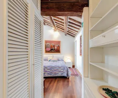 a bedroom with a bed in a room at Appartamento Piazza del parlamento 3 in Rome