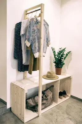 a shelf with clothes on it next to a wall at Santa Nara B&B in Rome