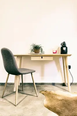 a desk with a chair next to a table at Santa Nara B&B in Rome