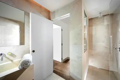 a bathroom with a shower and a glass door at Hotel Palazzo Manfredi – Small Luxury Hotels of the World in Rome