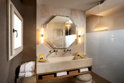 a bathroom with a sink and a mirror at Hotel Palazzo Manfredi – Small Luxury Hotels of the World in Rome