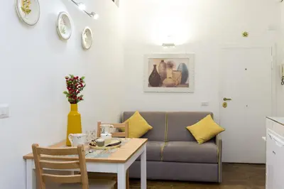 a living room with a couch and a table at STELLA'S APARTMENT IN MONTI in Rome